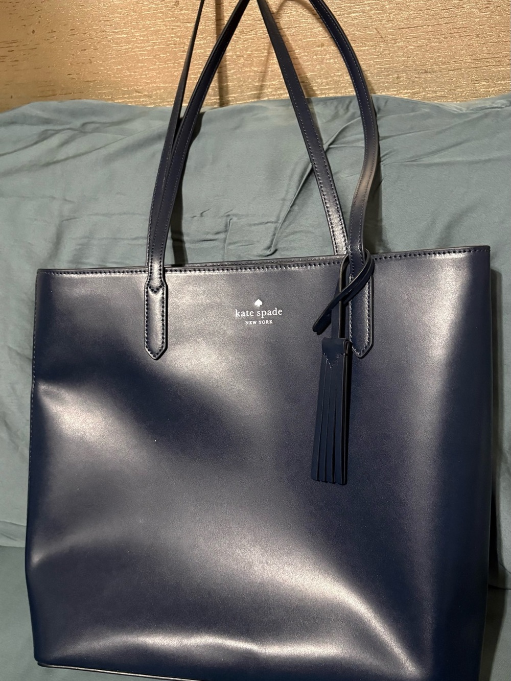 Kate Spade NWOT beautiful navy blue handbag with tassel and shoulder straps